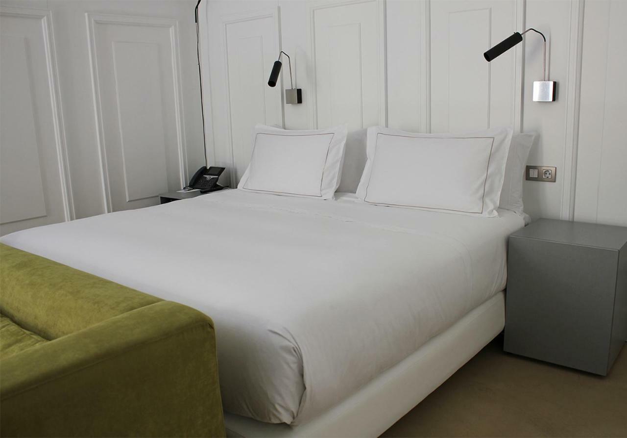 默瑟尔eme教堂酒店 塞维利亚 外观 照片 A bed with a duvet