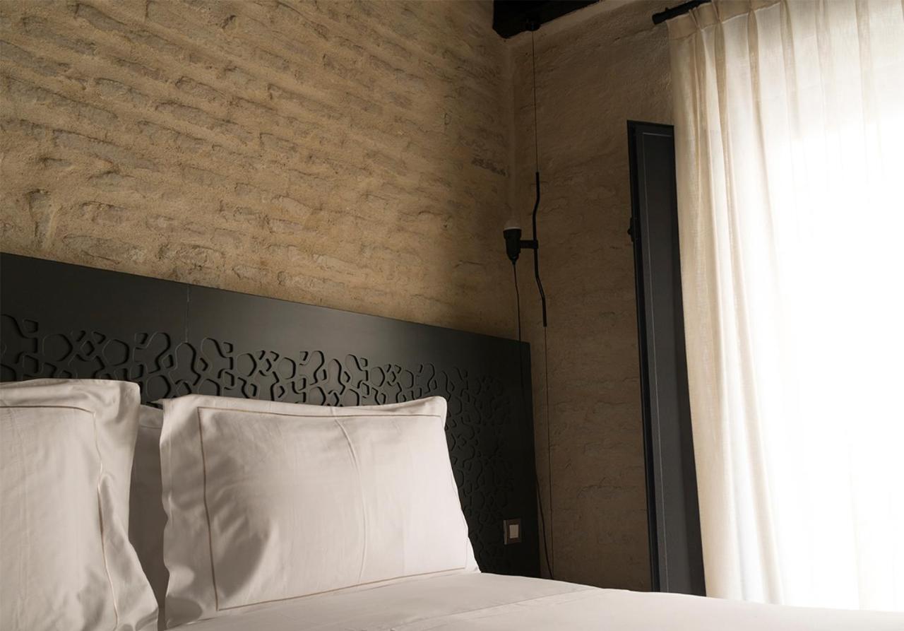 默瑟尔eme教堂酒店 塞维利亚 外观 照片 A bedroom at the hotel